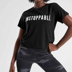 T-shirt ATHLETA taglia XL NERA INARRESTABILE GRAFICA MANICA CORTA BIO DAILY CROP TOP - Foto 1 di 8