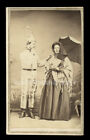 weird 1860s cdv photo dunce or clown & woman with parasol torn painted backdrop