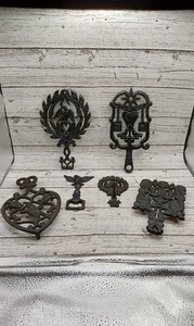 NICE LOT OF CAST IRON TRIVETS - Picture 1 of 13