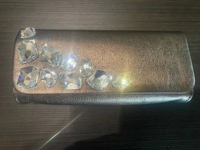 Bolso sin asas INGE CHRISTOPHER para mujer de cuero dorado oscuro cristal Swarovski Foto 1 de 4