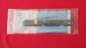 NEW OEM Silver Pontiac "SUNBIRD" Nameplate Emblem Badge 22580252