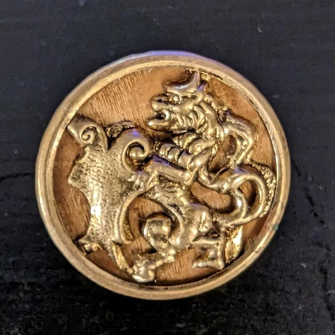 Antique Stamped Brass Lion w/ Shield Button w/ Wood Background 7/8in - L001 Cover