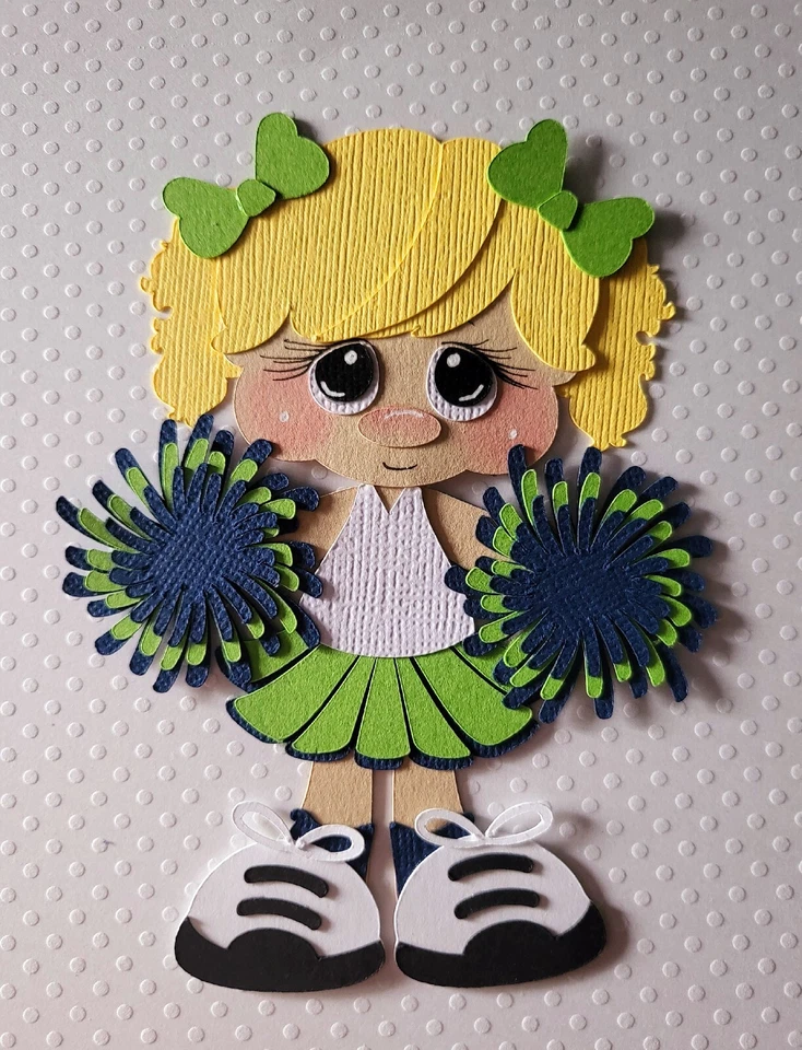 Cheerleader pelo rubio de pie azul/verde. Álbum de recortes, piezas de papel para hacer tarjetas Foto 1 de 1