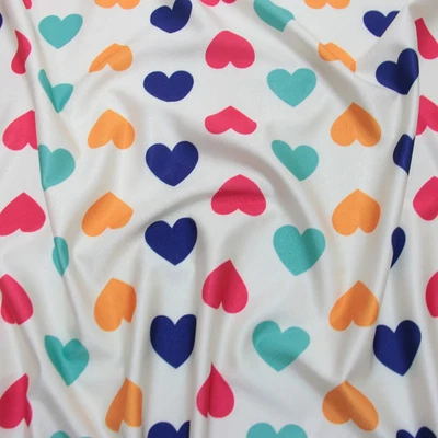 Tela de traje de baño de spandex de nailon marfil coloridos corazones sobre marfil Foto 1 de 4