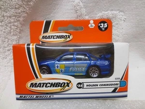 MATCHBOX MB 35/75 BLUE POLICE HOLDEN COMMODORE UNOPENED - Bild 1 von 5