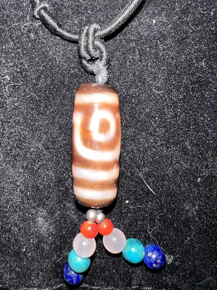 Antiguo Dzi tibetano - dos ojos Foto 1 de 4