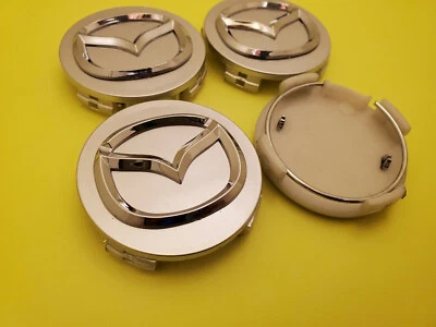 Tapacubos centrales de rueda plateados MAZDA 56 mm 4 piezas - Mazda 3/5/6, Miata, RX 8, CX-3/5/7/9... Foto 1 de 4