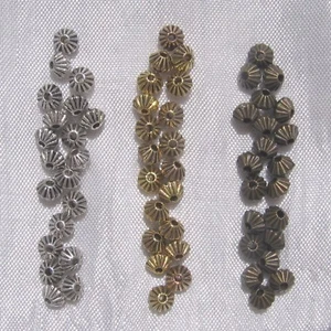 40 Zwischenlagen AUSWAHL Kreisel Perlen 5mm Metallperle vergoldet versilbert oder bronze - Bild 1 von 7