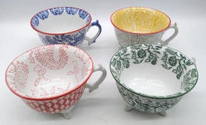 Gemischtes 4er Set Joyye Keramiktassen mit drei Füßen. Blau, Gelb, Rot & Grün Design - Bild 1 von 18