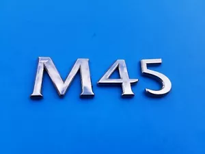 2006 2007 2008 INFINITI M45 REAR EMBLEM BADGE SYMBOL LOGO USED 06 07 08 OEM A8 - Picture 1 of 3