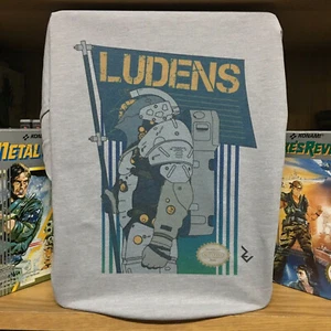 Kojima Productions Ludens NES Cover T-Shirt - 8bit Inspired by Death Stranding - Picture 1 of 2