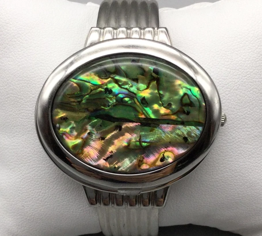 Reloj con esfera oculta con carcasa de abulón para mujer 43 mm tono plateado puño abierto batería nueva Foto 1 de 4