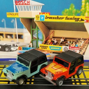 2 x Jeep Wrangler C7 Magnatraction 1/64 HO Scale Slot Car Tomy Aurora AFX TYCO - Picture 1 of 15