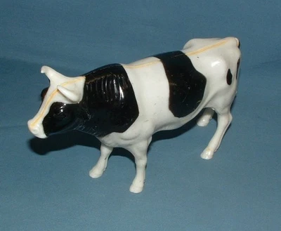 VINTAGE HARD PLASTIC HOLSTEIN COW 8" LONG FIGURE - NYLINT - USED - Image 1 of 4