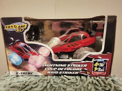 TOYS R US - NEW - Fast Lane X-TREME LIGHTNING STRIKER RC Car - Image 1 of 2