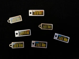 1960's Set of 7 - Disabled American Veterans CALIFORNIA MINI LICENSE PLATE TAGS - Picture 1 of 9