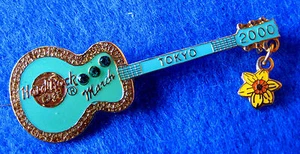 TOKYO AQUARMARINE STONES & DAFFODIL FLOWER BIRTHSTONE GUITAR Hard Rock Cafe PIN - Picture 1 of 1