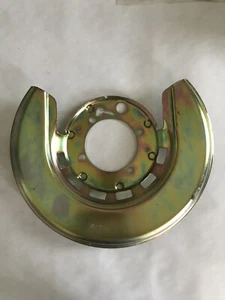 1976-1982 Corvette LEFT FRONT Trailing Arm Backing Plate GOLD NEW - Picture 1 of 3