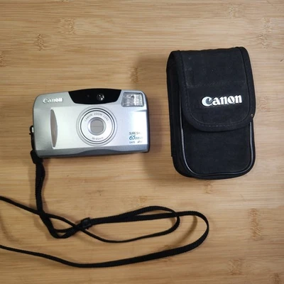 Cámara fotográfica Canon Sure Shot 65 zoom fecha SAF 35 mm apuntar y disparar compacta con estuche Foto 1 de 4