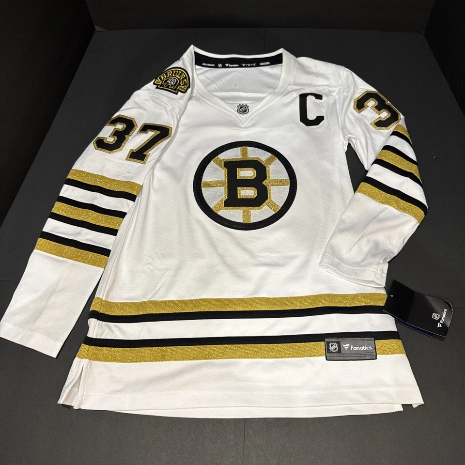 女士的狂热波士顿棕熊队 Patrice Bergeron #37 NHL 曲棍球球衣中号全新带标签 — 第 1/4 张图片