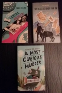 3 New PB Mysteries: LIGHTS, CAMERA, MURDER!; 2 HEADS ARE DEADER THAN 1; A Most.. - Bild 1 von 2