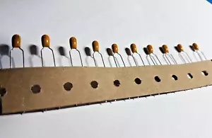 TANTALUM BEAD CAPACITOR 1uf / 35v QTY 100 Taped - Picture 1 of 2