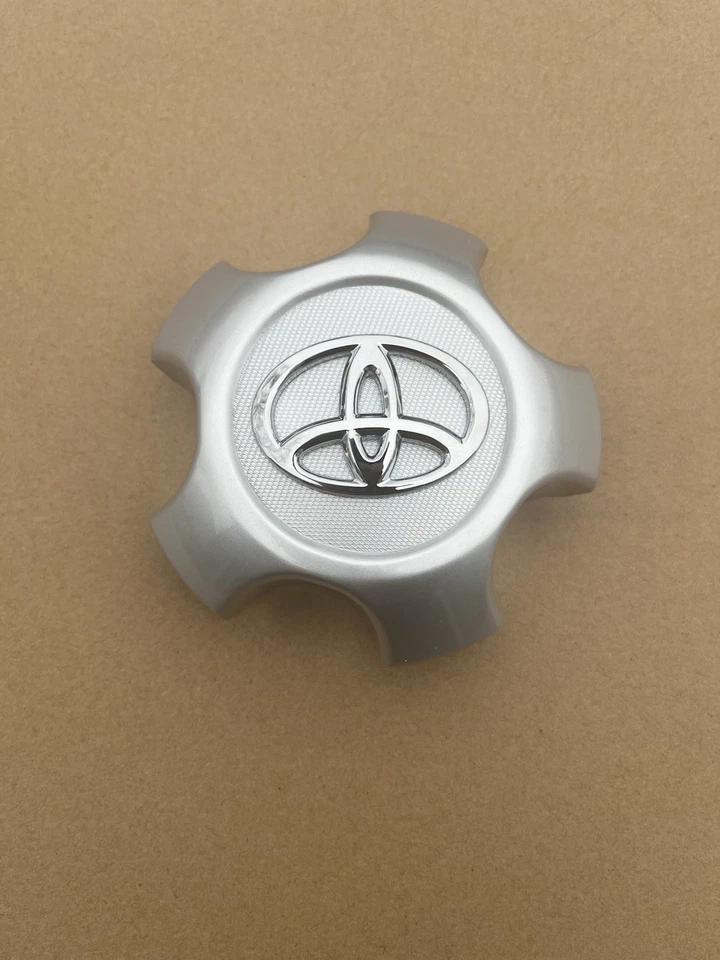 Original OEM Toyota 42603-42100 acero tapa central adorno 2006-2012 RAV4 Foto 1 de 4