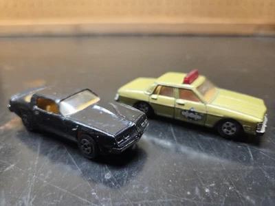 2 Vtg ERTL 1:64 Smokey and the Bandit Firebird & Pontiac Bonneville Police Car - Image 1 of 4