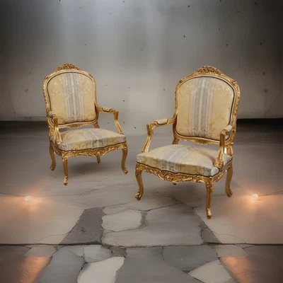 Un par de sillas de madera dorada estilo Luis XV Fauteuils (siglo XX) Foto 1 de 4