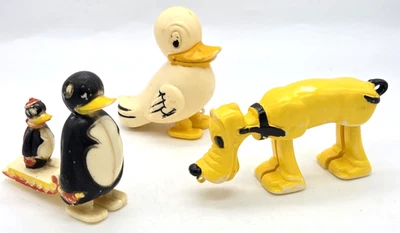 3 caminantes rampa de plástico de juguete vintage Plutón pingüinos en trineo y pato Hong Kong Foto 1 de 4
