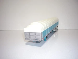 DCP PRIMA MARCIA 1/64 TURCHESE E BIANCO WILSON ROADBRUTE ASSE DI DIFFUSIONE CARRO COPERTO - Foto 1 di 5