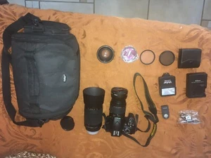 Nikon D3400, many different lenses, battery charger with extra battery  - Picture 1 of 2