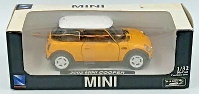 New Ray Yellow 2002 Mini Cooper, 1:32, Diecast Pull Back NEW Open Box - Image 1 of 3