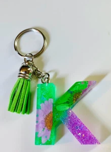 Llavero con letras verdes/púrpura brillantes - Imagen 1 de 1