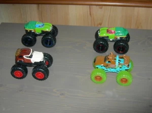 LOT OF 4 HOT WHEELS MONSTER TRUCKS....... 2 TURTLES, DONKEY KONG, AND SCOOBY DOO - Picture 1 of 1