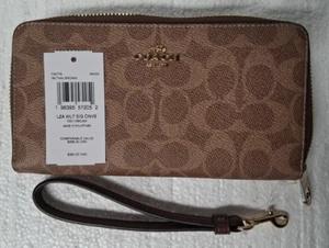 Nuovo con etichette ~ Coach CW778 Portafoglio da polso lungo con zip e cinturino firmato marrone/marrone - Foto 1 di 9