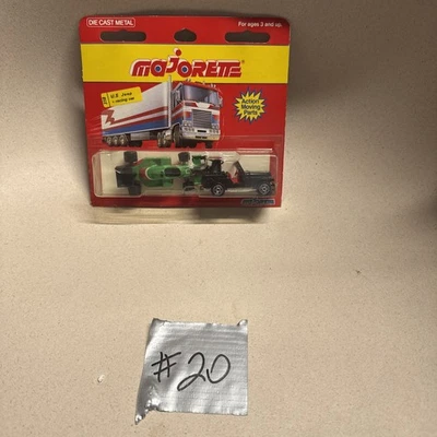 New Majorette #318 Green  Racing Car & Black Jeep 4x4 Die Cast Card Shows Wear - Image 1 of 4