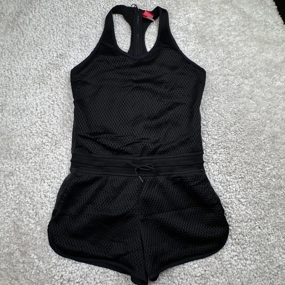 Mameluco de malla Nike Court negro para mujer pequeño Foto 1 de 4