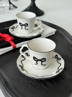 Juego de tazas de café de porcelana Bow Design para 2 personas | 4 piezas blanco y negro elegante des Foto 1 de 4