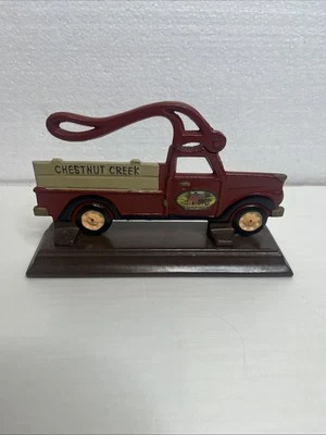 Vintage Cast Iron Chestnut Creek Country Red Farm Truck Nut Cracker Wooden Stand - Image 1 of 3
