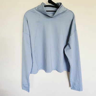 Camisa corta para mujer ATHLETA Whistler cuello falso talla XL azul agujeros para el pulgar Foto 1 de 4