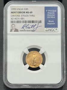 1999 $5 1/10ozt American Gold Eagle NGC MS 69, Mint Error Obverse Struck Thru - Picture 1 of 5