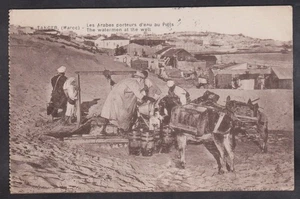 1921 POSTCARD THE WATER MEN WITH DONKEY'S AT THE WELL,TANGIER,MOROCCO - Picture 1 of 2