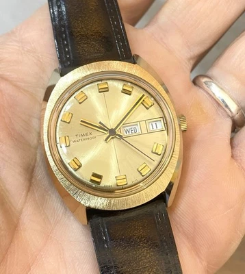 Reloj mecánico Timex Marlin 26960-2773 vintage para hombre tono dorado día-fecha años 70 Foto 1 de 4