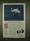 1990 Annonce pour appareil photo Canon EOS 1 avec grue blanche - faune