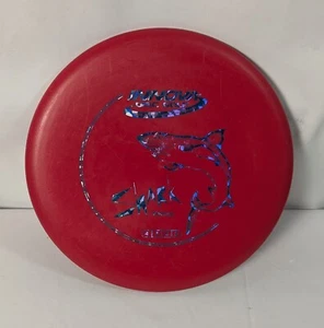 Disco de golf Innova Disc Golf DX Shark 147 g rojo azul lámina gama media usado en excelente estado - Imagen 1 de 3