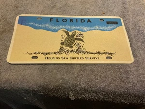 Metal Novelty License Plate Florida Helping Sea Turtles Survive - Picture 1 of 1