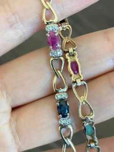 7 Ct Oval Simulated Ruby Infinity Style Tennis Bracelet 14K Yellow Gold Plated - Picture 1 of 5