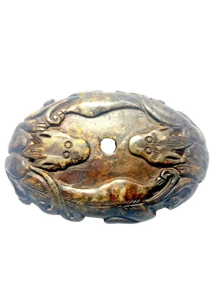 UN BIDISCO OVALADO JADE BLANCO CARBONIZADO, DINASTÍA HAN CHINA 206BC-220 AD. Foto 1 de 4