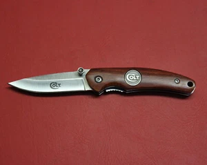 Colt Firearms Factory Wood Handled Knife - Picture 1 of 2
